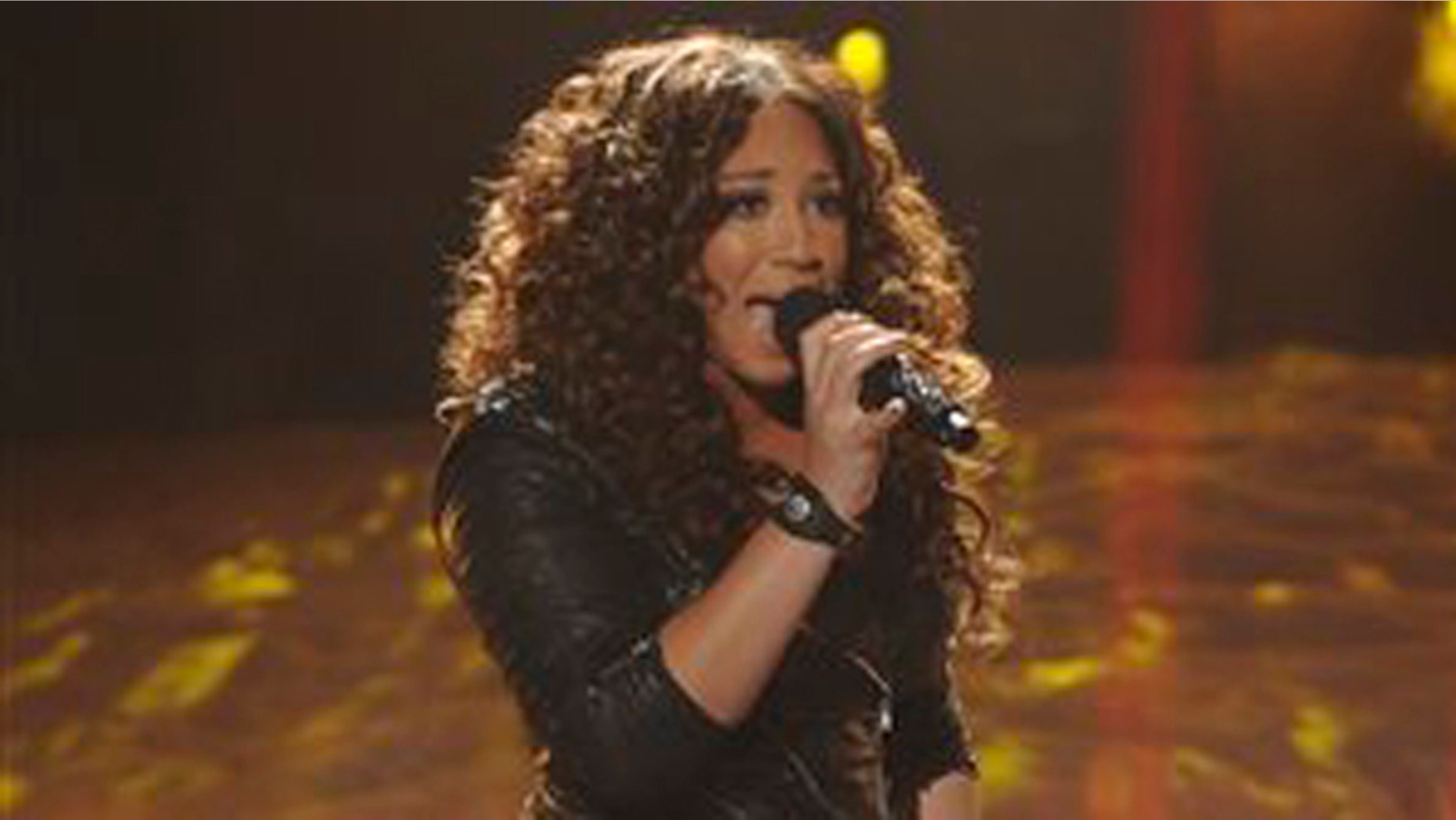 In this Nov. 30, 2011 file photo released by FOX, Melanie Amaro performs on the singing competition series, "The X Factor," in Los Angeles, where contestants sang songs by Michael Jackson for a tribute to the late King of Pop.