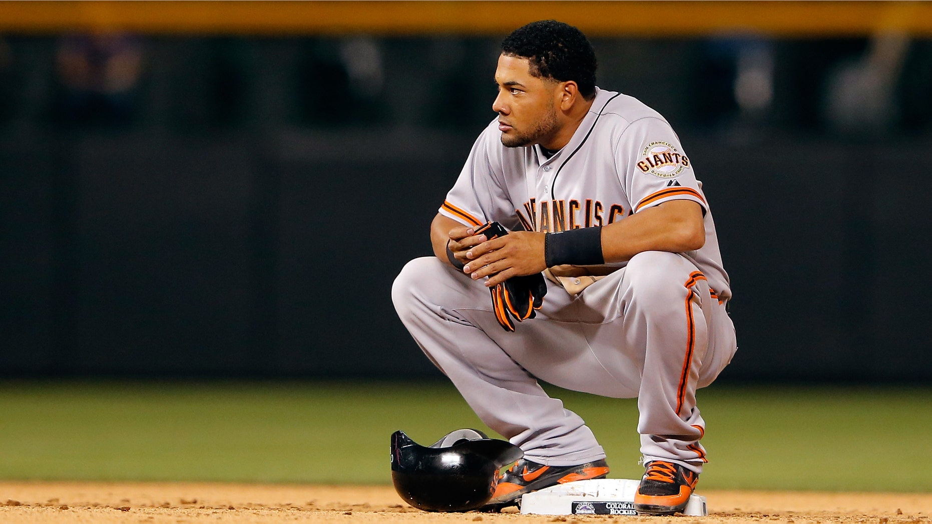DENVER, CO - AUGUST 03: Melky Cabrera #53 of the San Francisco Giants pauses at second base after doubling against the Colorado Rockies at Coors Field on August 3, 2012 in Denver, Colorado. The Giants defeated the Rockies 16-4. (Photo by Doug Pensinger/Getty Images)