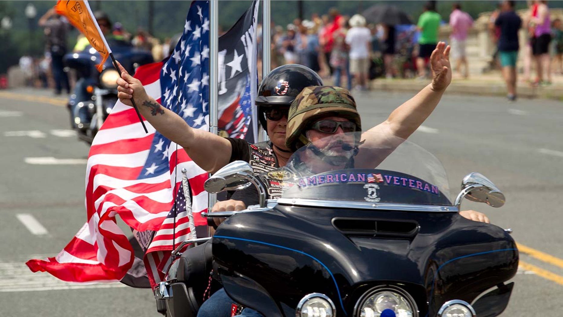 Participants in the Rolling Thunder motorcycle rally ride past Arlington Memorial Bridge ahead of Memorial Day in Washington.