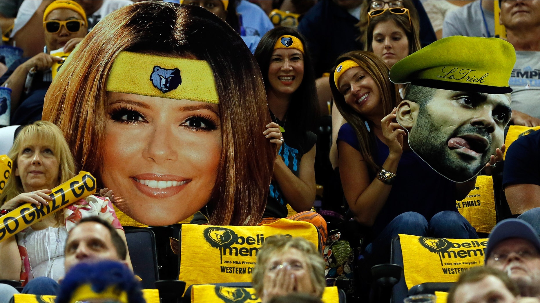 MEMPHIS, TN - MAY 25: Fans hold up cut-outs of actress Eva Longoria and Tony Parker #9 of the San Antonio Spurs in the first half during Game Three of the Western Conference Finals of the 2013 NBA Playoffs at the FedExForum on May 25, 2013 in Memphis, Tennessee. NOTE TO USER: User expressly acknowledges and agrees that, by downloading and or using this photograph, User is consenting to the terms and conditions of the Getty Images License Agreement. (Photo by Kevin C. Cox/Getty Images)