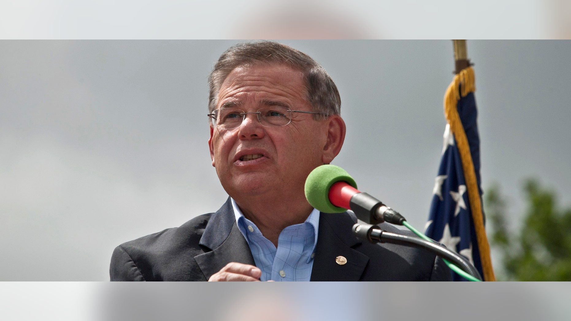NEW YORK, NY - JULY 4: U.S. Sen. Robert Menendez (D-NJ) speaks at the reopening ceremony of the Statue of Liberty on the first day it is open to the public after Hurricane Sandy on July 4, 2013 on the Liberty Island in New York City. The statue was mostly spared by the storm, but the surrounding infrastructure was badly damaged. (Photo by Kena Betancur/Getty Images)