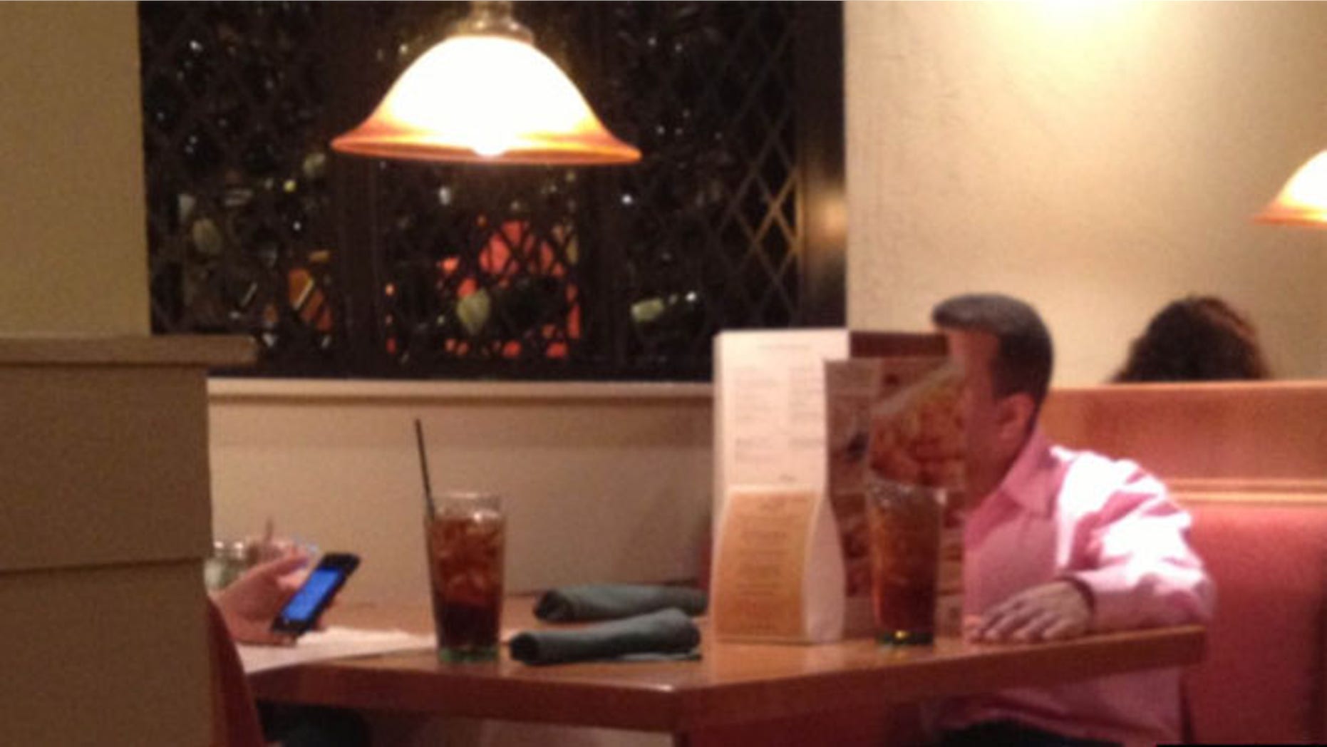 Diner Adam Howell captured this image of a feuding couple at a North Carolina Olive Garden that has since gone viral.