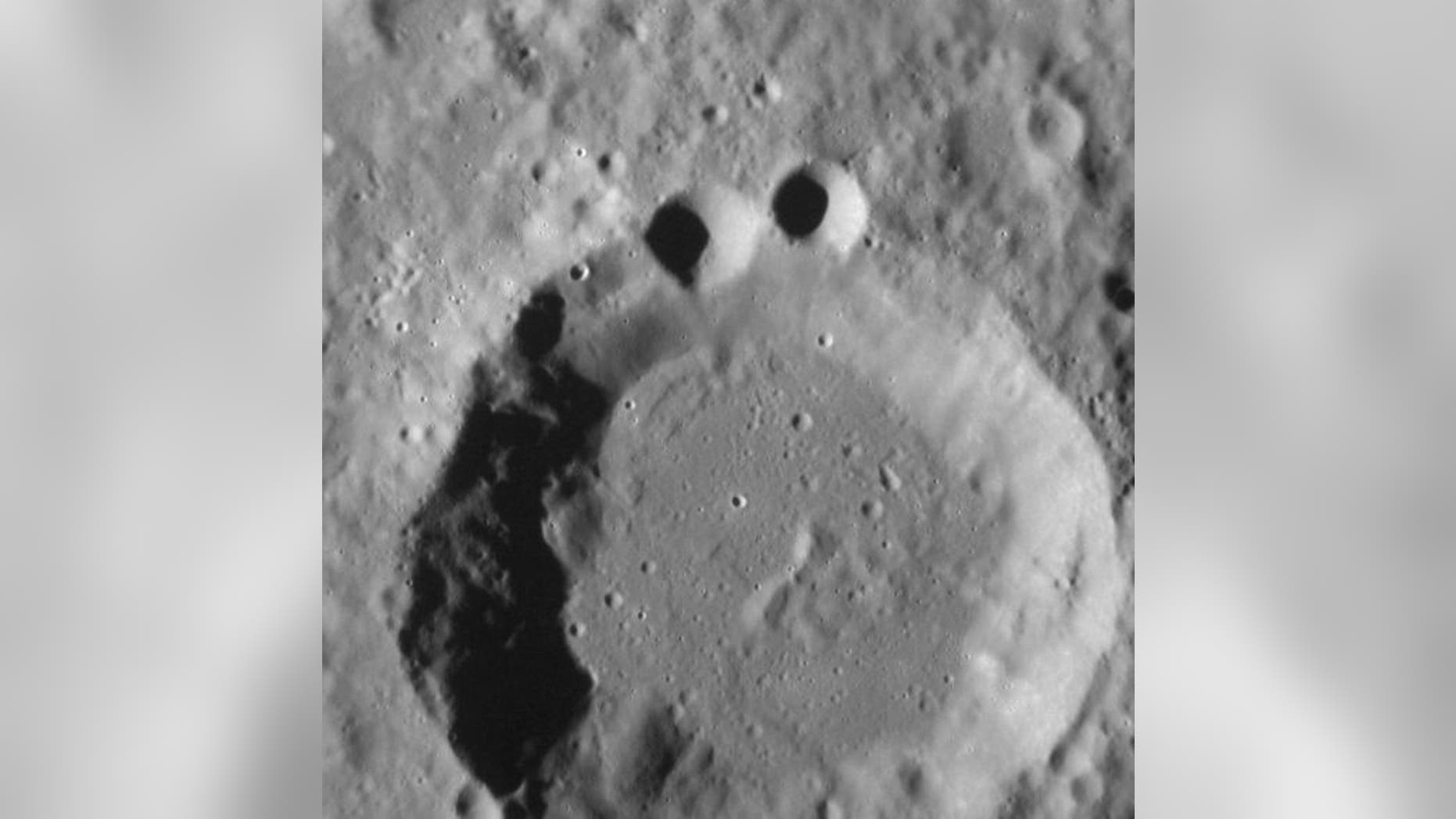 Craters photographed by MESSENGER spacecraft may appear to resemble a familiar television character, a favorite of children. Image acquired August 29, 2012.