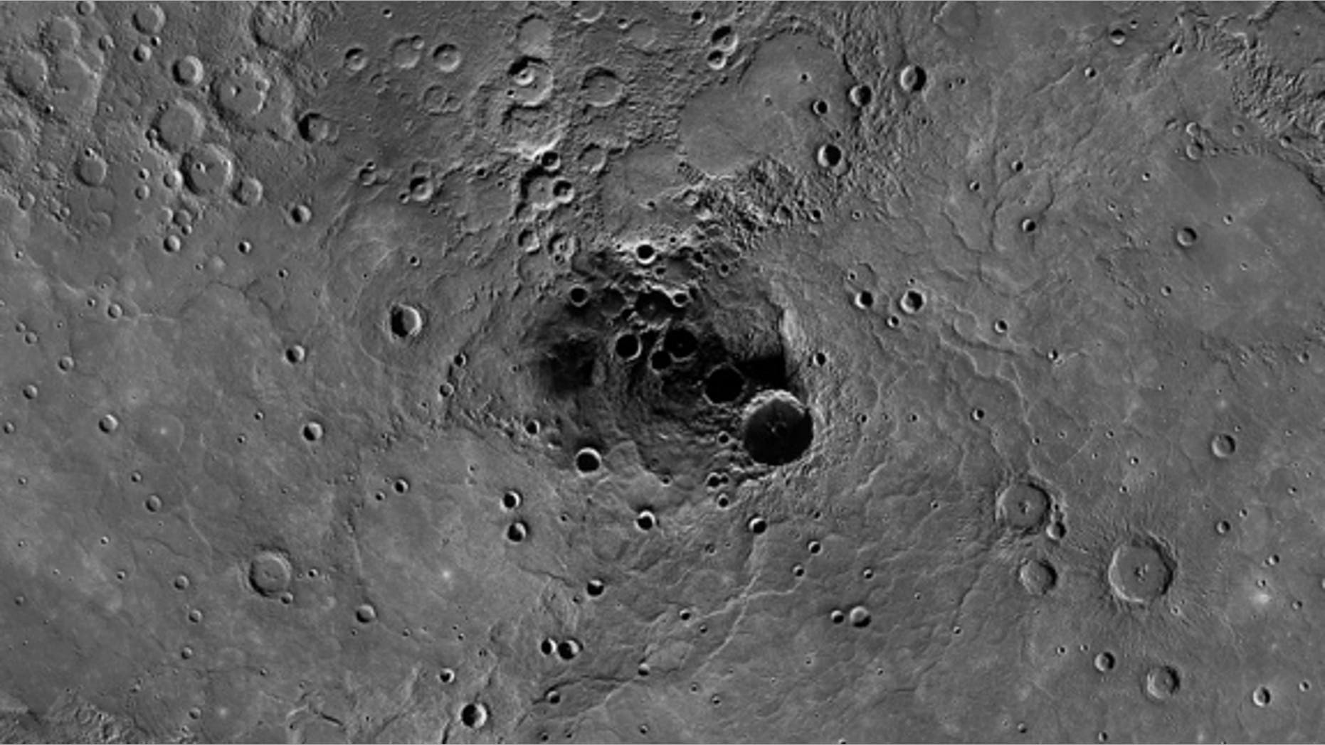 This photo mosaic of Mercury's north pole from NASA's Messenger spacecraft shows radar-bright deposits inside permanently shadowed craters on the planet. Messenger has confirmed the presence of water ice inside these regions, scientists announc