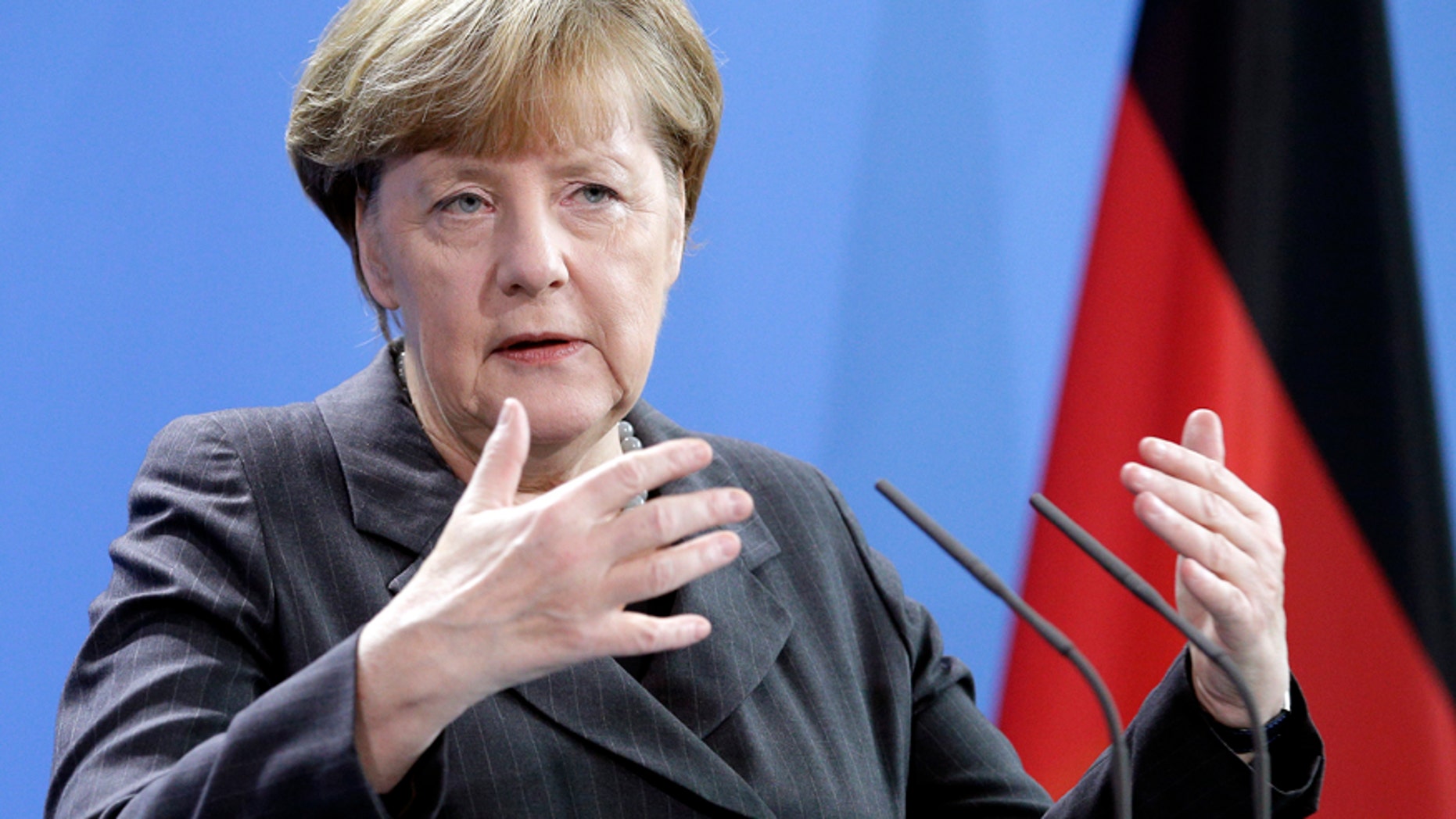 German Chancellor Angela Merkel gestures during a joint press conference with Prime Minister of Italy Matteo Renzi as part of a meeting at the chancellery in Berlin, Germany, Friday, Jan. 29, 2016. (AP Photo/Michael Sohn)