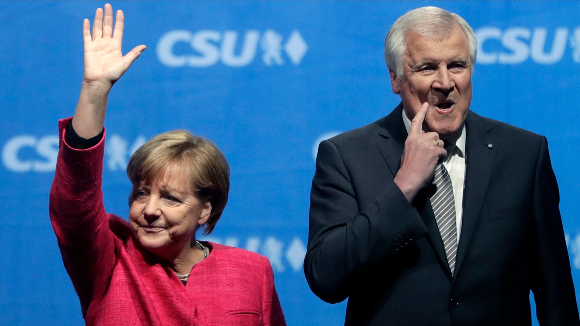 Angela Merkel and Horst Seehofer in happer times, at a September 2017 campaign rally.