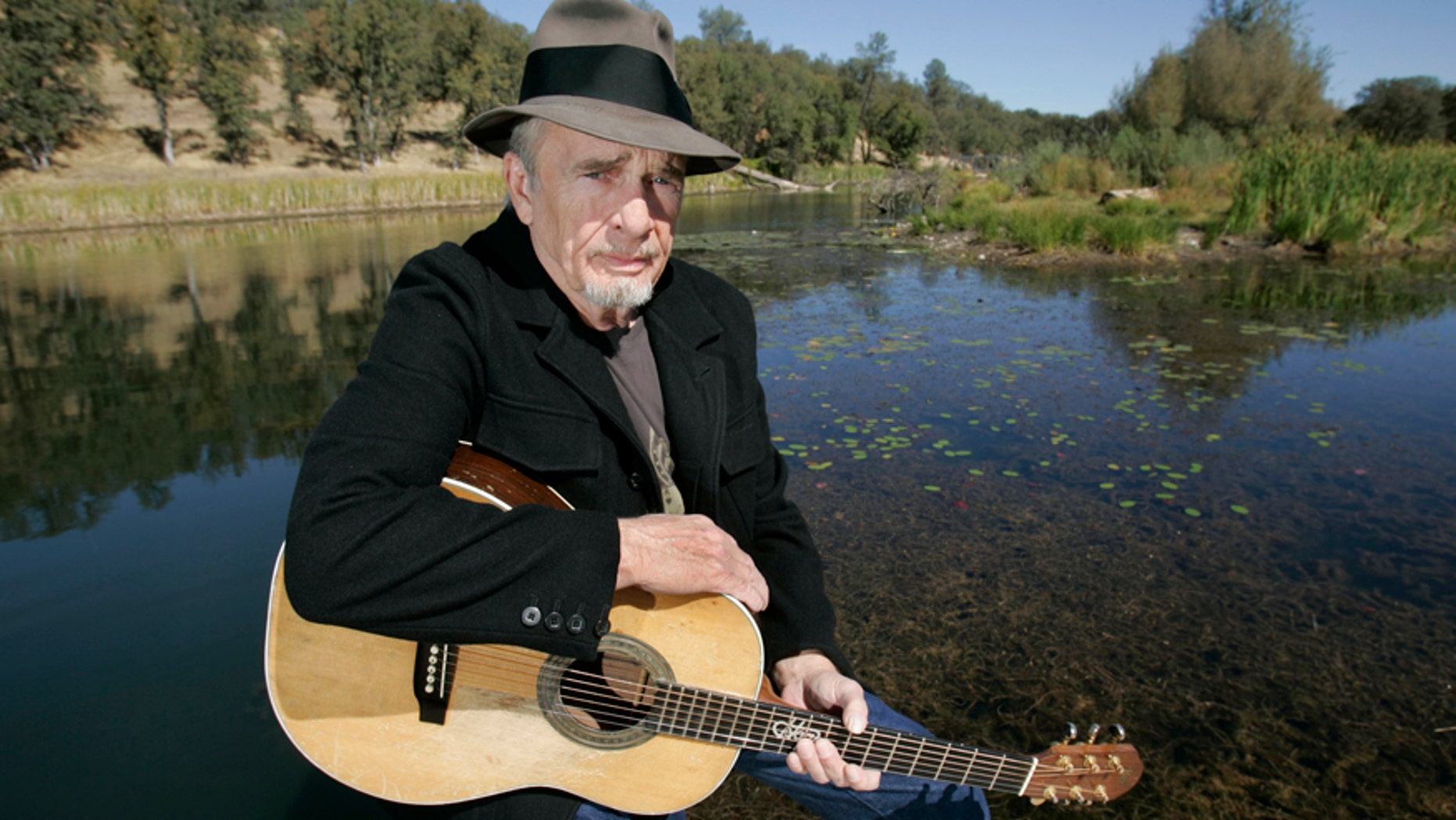 In this Oct. 2, 2007 file photo, Merle Haggard poses for a photo at his ranch at Palo Cedro, Calif. Haggard will be honored a year after his death with an all-star concert featuring his longtime friend and duet partner Willie Nelson as well as Kenny Chesney, Miranda Lambert and John Mellencamp. The country music star died of pneumonia on April 6, 2016, in Palo Cedro. He was 79.