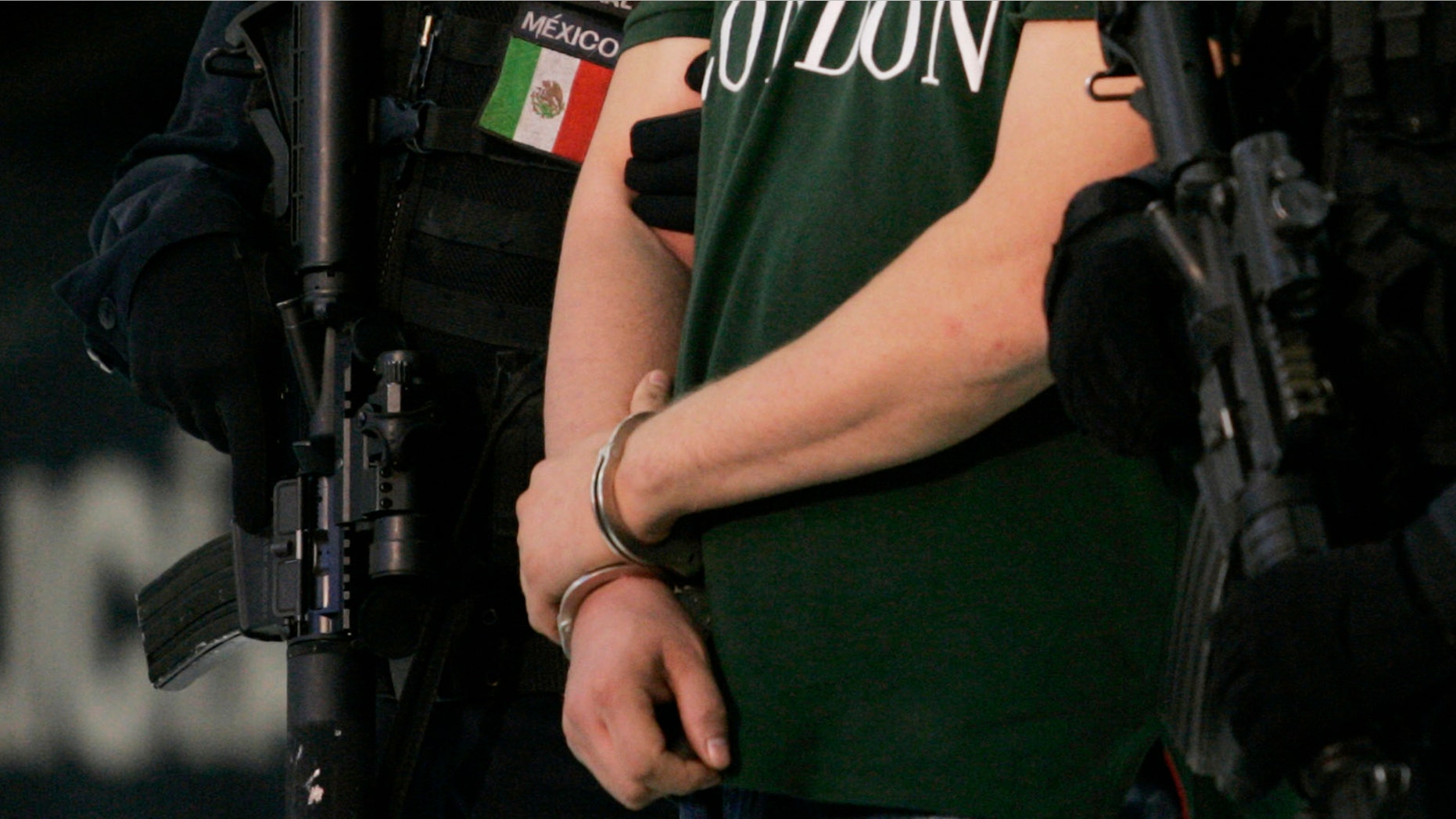 MEXICO CITY - AUGUST 31: Edgar "La Barbie" Valdez Villarreal is shown to the press during a news conference at the federal police center August 31, 2010 in Mexico City, Mexico. Valdez, a Texas-born drug smuggler and leader in the Beltran Leyva cartel, was captured August 30 by Mexican authorities in a residential area near Mexico City. (Photo by Daniel Aguilar/Getty Images)
