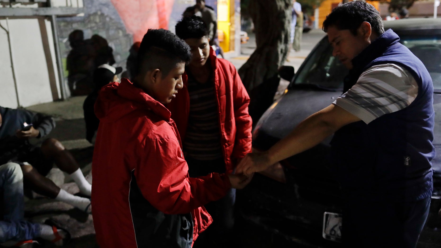 Men from Guatemala on their way to cross into the United States Nov. 14, 2016, in Tijuana, Mexico.