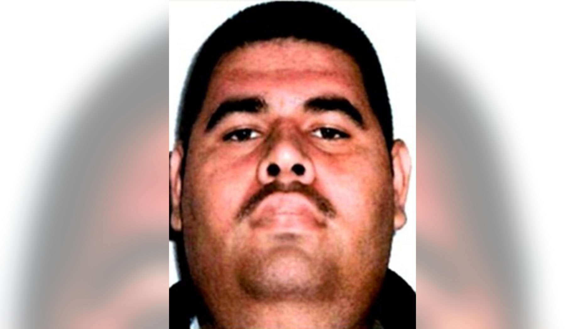 This photo released by Mexico's Federal Police shows a man it identifies as Juan Manuel Alvarez, one of the alleged top money-launderers for drug lord Joaquin El Chapo Guzman, in an unknown location. Federal police said on its Twitter account Sunday, March 27, 2016 that Alvarez was arrested in Oaxaca state.