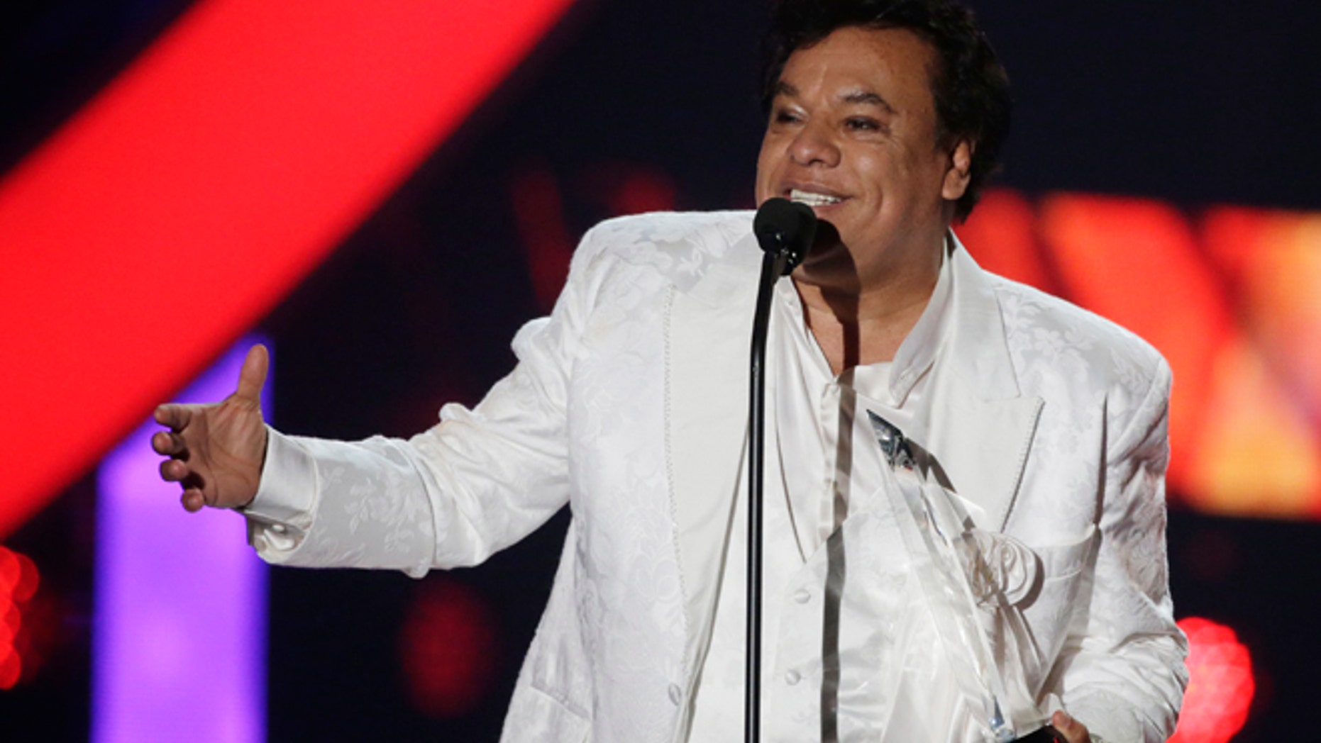In this April 28, 2016, file photo, singer Juan Gabriel receives the Star Award at the Latin Billboard Awards, in Coral Gables, Fla.