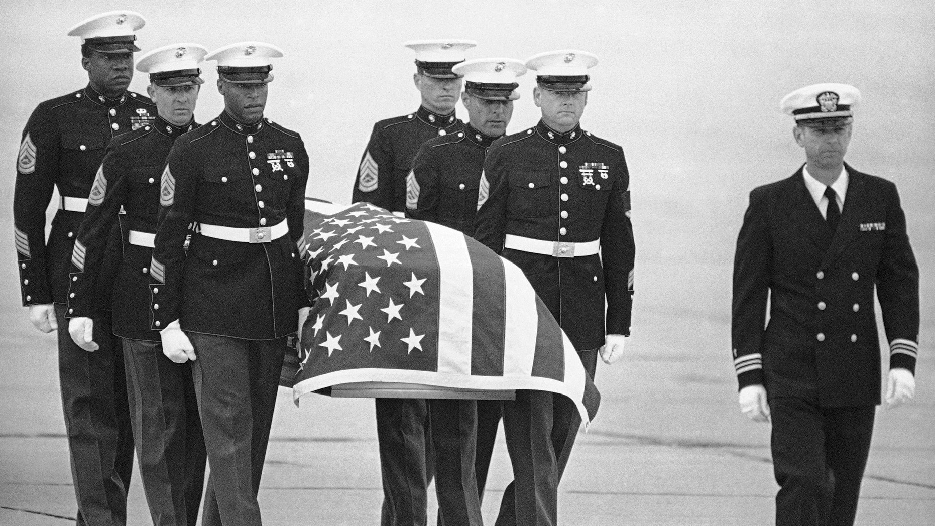 FILE - In this March 8, 1985, file photo, U.S. Marine Corps pallbearers carry the casket holding the body of slain U.S. Drug Enforcement agent Enrique Camarena Salazar after it arrived at North Island Naval Air Station, in San Diego.