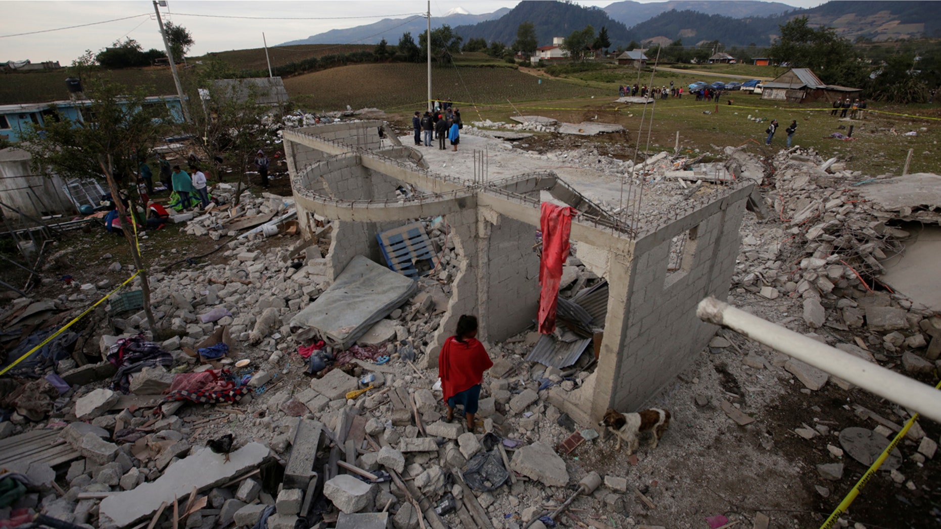 Residents stand next debris after fireworks stored in a house exploded in San Isidro, Chilchotla, Mexico May 9, 2017. REUTERS/Imelda Medina - RTS15UU2