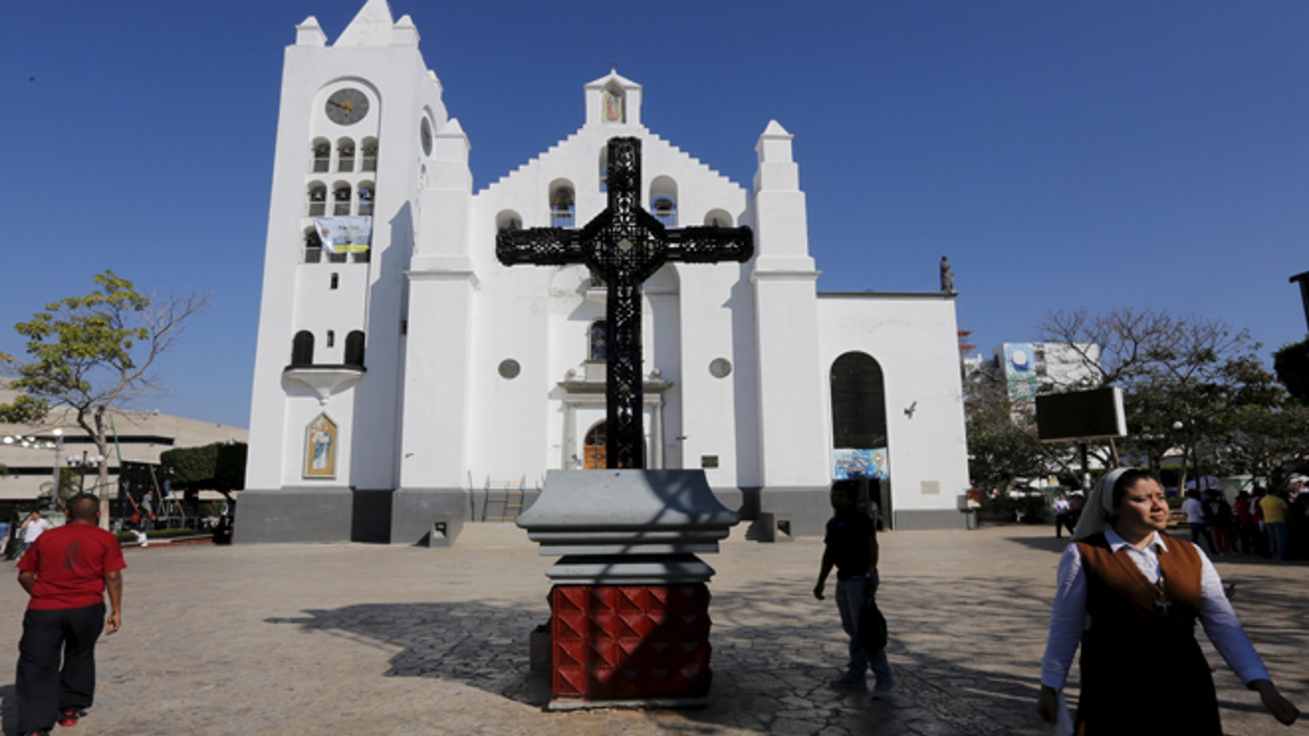 A Catholic nun walks outside the San Marco cathedral in Tuxtla Gutierrez, Chiapas, Mexico February 14, 2016.