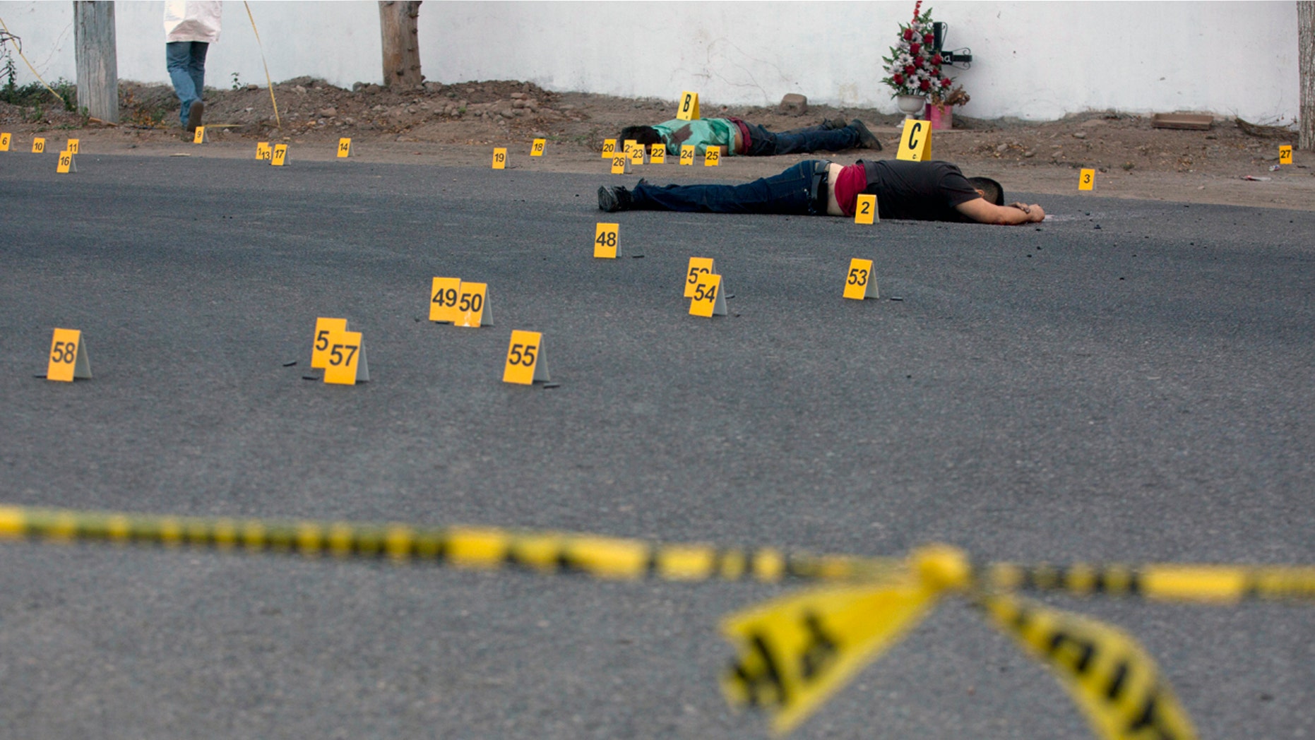 Bodies lie beside a road after a shooting in Mexico's Sinaloa state this past June.