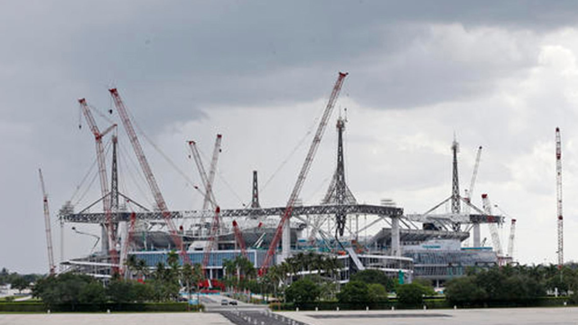 In this, Saturday, May 21, 2016, photo, the stadium where the Miami Dolphins play football is shown under renovation in Miami Gardens, Fla.