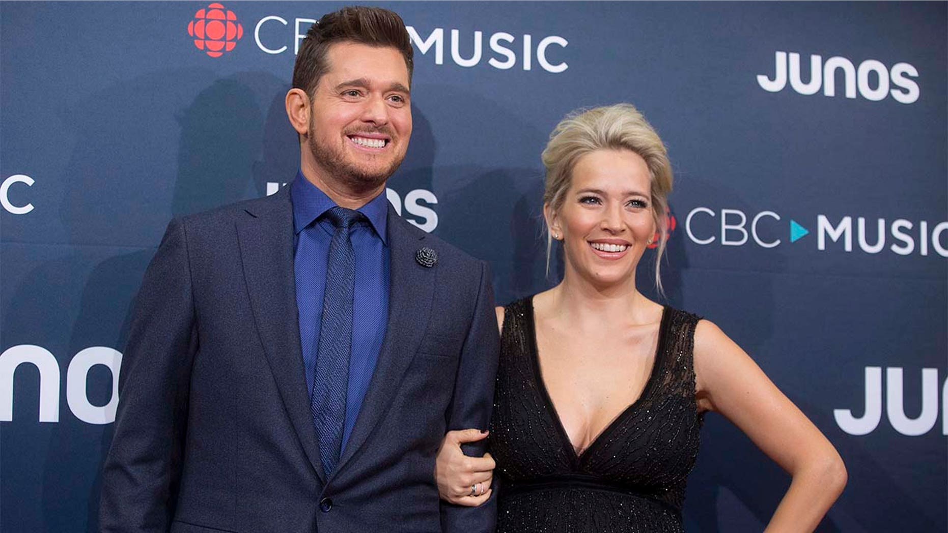 FILE - In this March 25, 2018 file photo, Michael Buble and his wife Luisana Lopilato at the Juno Awards in Vancouver, British Columbia. Buble and Lopilato are the proud parents of a baby girl. Buble's representative says that Vida Amber Betty was born Wednesday in Vancouver. She is 6 pounds, 1 ounce. Buble and Lopilato also have two sons, Elias and Noah. Lopilato, an Argentine TV actress, posted a photo of her baby girl's hand Thursday on Instagram.