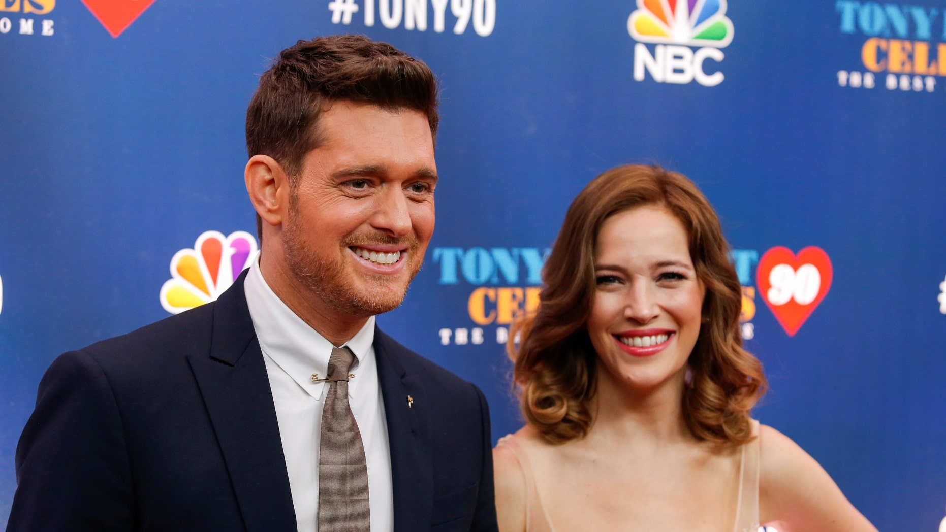 Singer Michael Buble (L) and Luisana Lopilato walk on the red carpet for "Tony Bennett Celebrates 90: The Best Is Yet to Come" at the legendary Radio City Music Hall in New York, U.S., September 15, 2016.