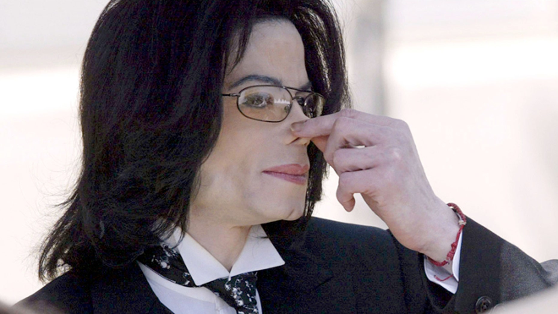 April 12, 2005: Michael Jackson touches his nose as he departs the Santa Barbara County courthouse in Santa Maria, Calif.