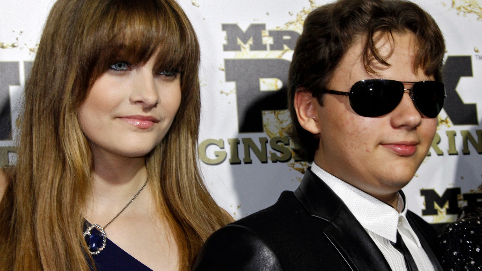 Paris and her brother Prince, children of the late Michael Jackson, arrive at the Mr. Pink Ginseng Drink launch party at the Beverly Wilshire Hotel in Beverly Hills, California, October 11, 2012.