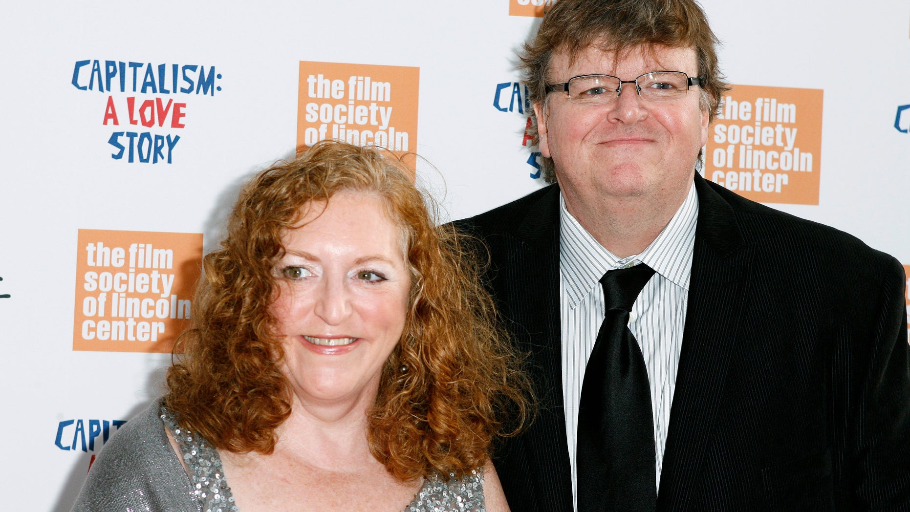 September 21, 2009. Director Michael Moore arrives with his wife Kathleen Glynn to attend a screening of the film "Capitalism: A Love Story" in New York.