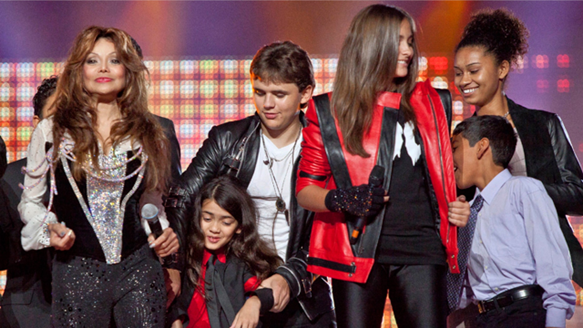 Oct. 8: From left, Latoya Jackson, Blanket Jackson, Prince Jackson, Paris Jackson and others join together on stage for the finale of the Michael Forever the Tribute Concert, at the Millennium Stadium in Cardiff, Wales.