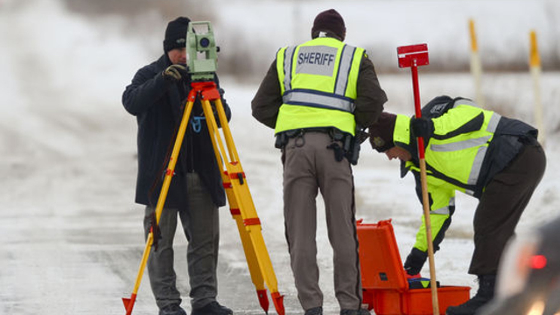 Jan. 30, 2014: Officers from the St. Clair County Sheriff's Department investigate a scene where bags of human remains were discovered at the intersection Allington and Fred Moore Highway in St. Clair Township, Mich.