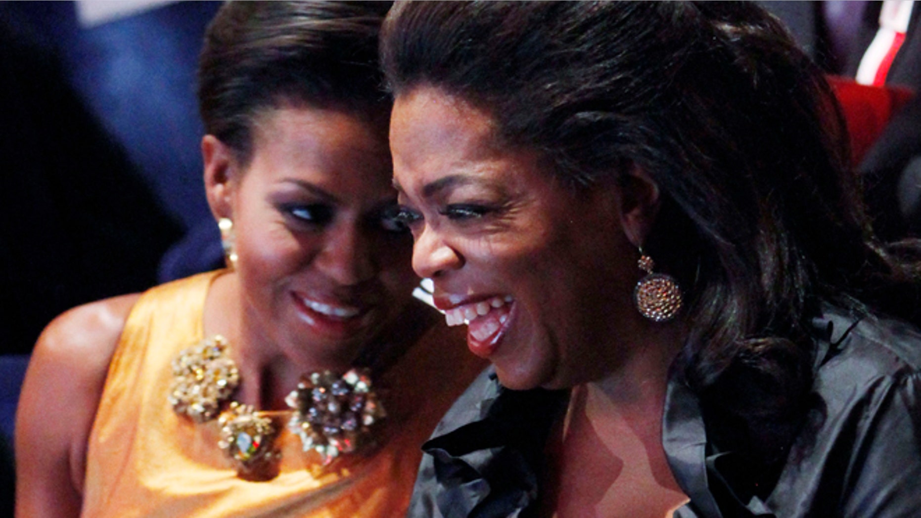 U.S. first lady Michelle Obama speaks with television talk show host Oprah Winfrey at the opening ceremonies of the the 121st International Olympic Committee (IOC) Session and XIII Olympic Congress at the Copenhagen Opera House October 1, 2009.