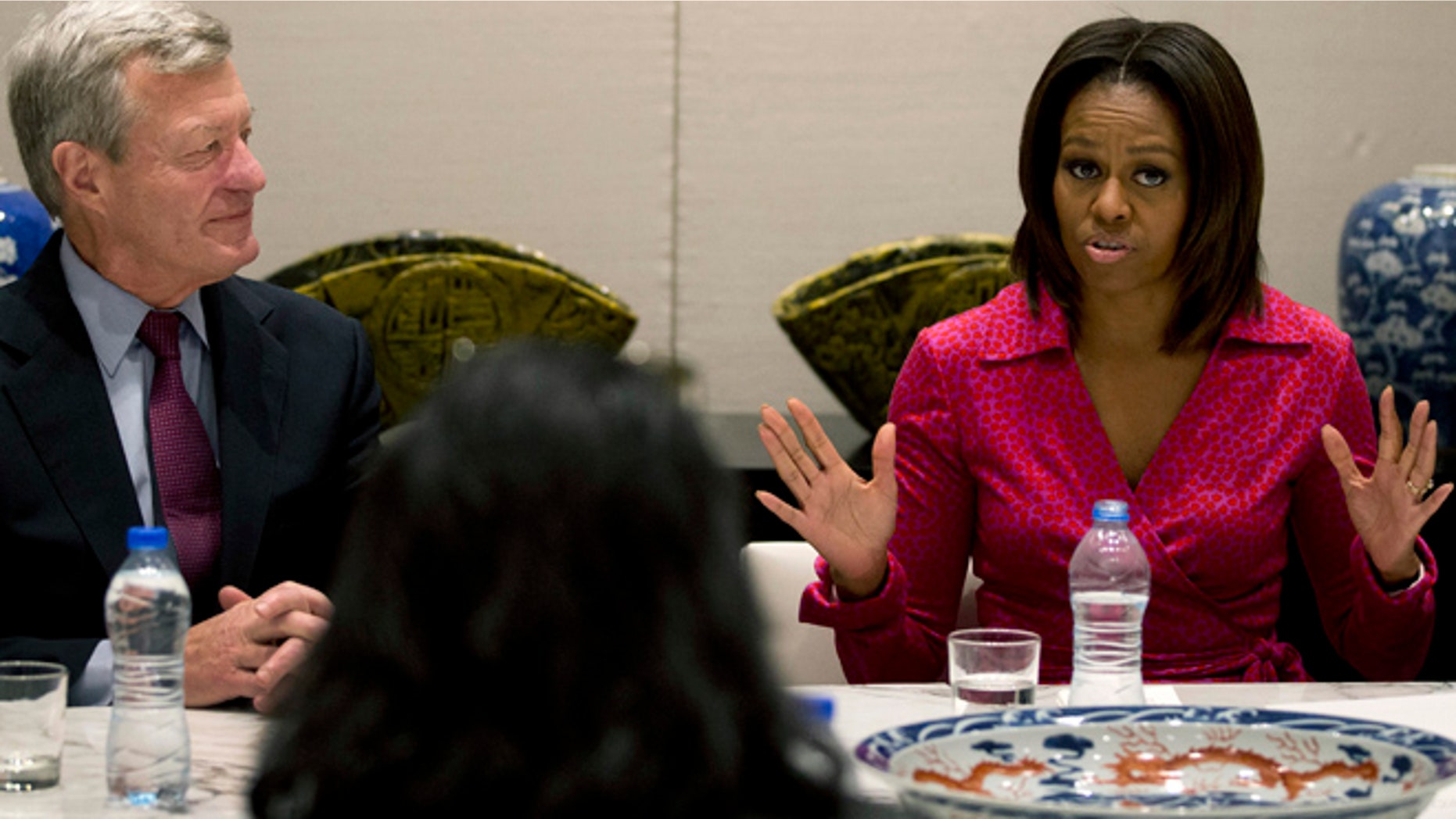 March 23, 2014: U.S. first lady Michelle Obama, right, speaks next to U.S. Ambassador to China Max Baucus as they attend a round table discussion on education at the U.S. Embassy in Beijing, China.