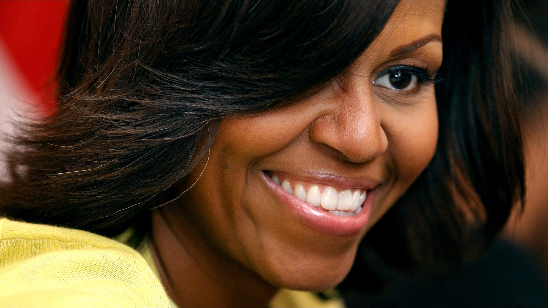 BETHESDA, MD - APRIL 04: To kick off the Month of the Military Child, first lady Michelle Obama participates in a pre-Easter celebration with military families and children at the Fisher House on Walter Reed National Military Medical Center April 4, 2012 in Bethesda, Maryland. The Fisher Houses are "comfort homes" that enable family members to be close to their military loved one during hospitalization for an unexpected illness, disease, or injury. Obama delivered Easter candies, visited with military children and gave away tickets to the White House Easter Egg Roll during the visit. (Photo by Chip Somodevilla/Getty Images)