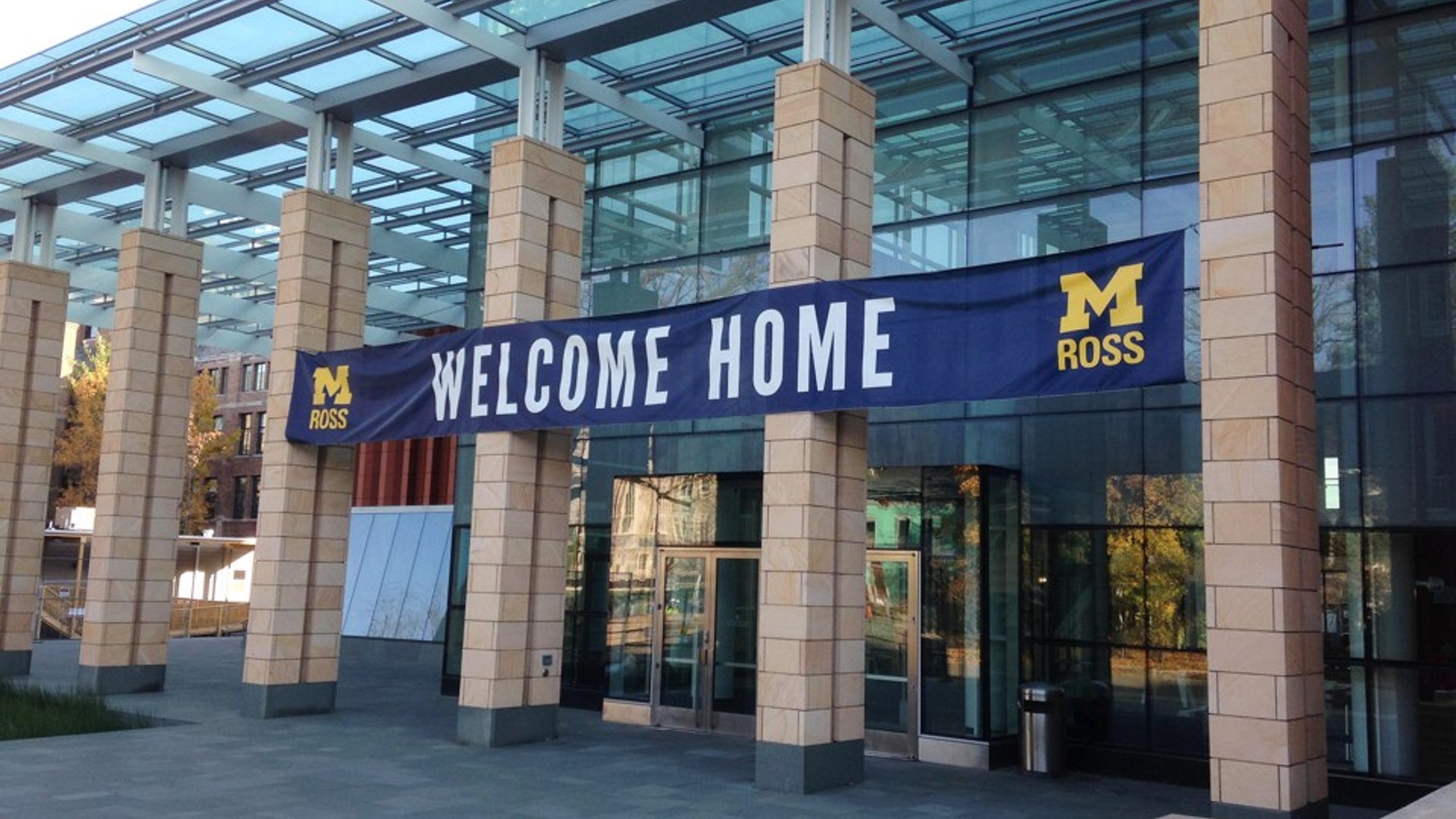 A sign welcomes visitors to the Stephen M. Ross School of Business on the University of Michigan campus in Ann Arbor, Mich., on Monday, Nov. 3, 2014. Crews working on a $135 million expansion of the Ross School moved a 65-foot-tall tree 500 feet from the side of the building to an area close to the front entrance. (AP Photo, Mike Householder)