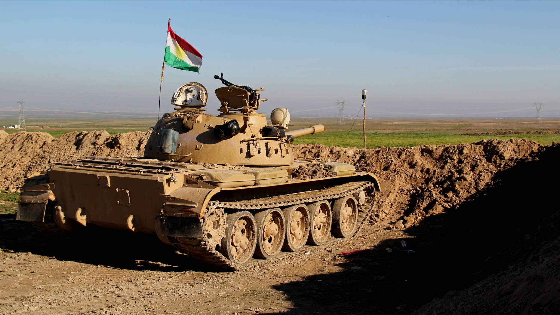 Jan. 20, 2015: Kurdish peshmerga forces prepare on the front line for battle against Islamic State group positions.
