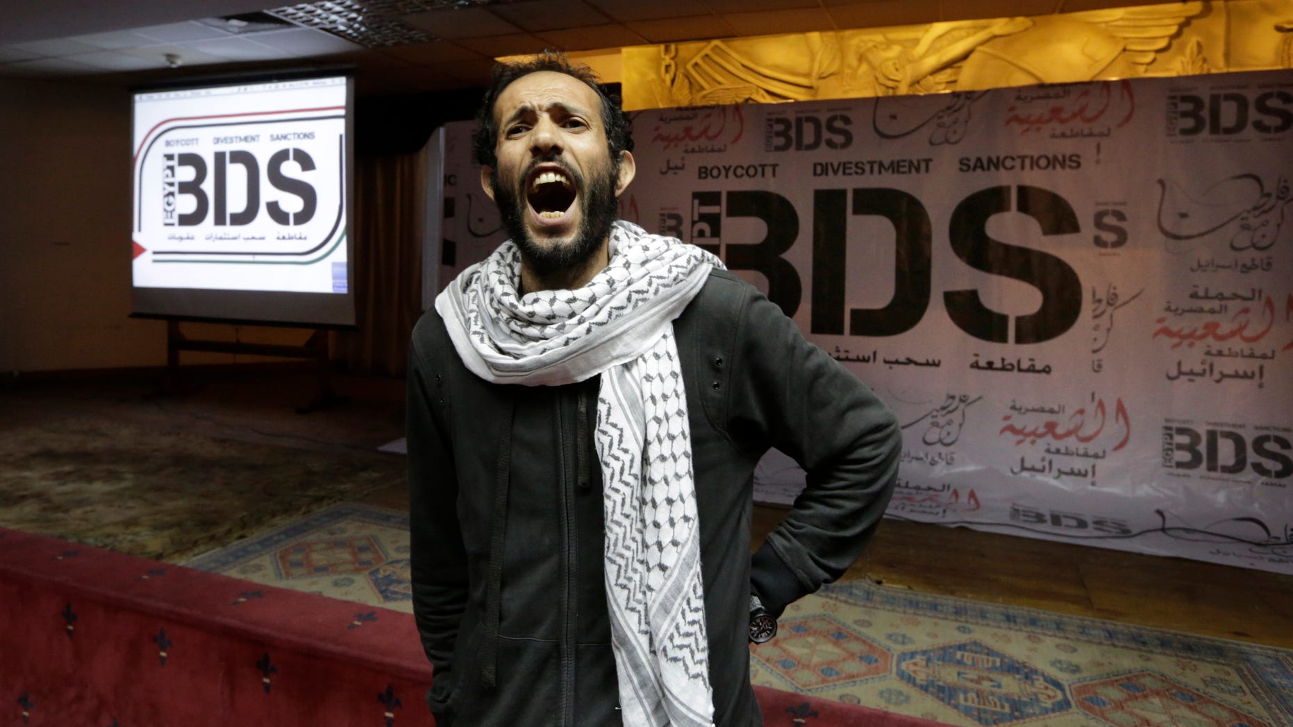 Apr. 20, 2015: Egyptian man shouts anti-Israeli slogans in front of banners with the Boycott, Divestment and Sanctions (BDS) logo during the launch of the Egyptian campaign that urges boycott, divestment and sanctions against Israel and Israeli-made goods. (AP)