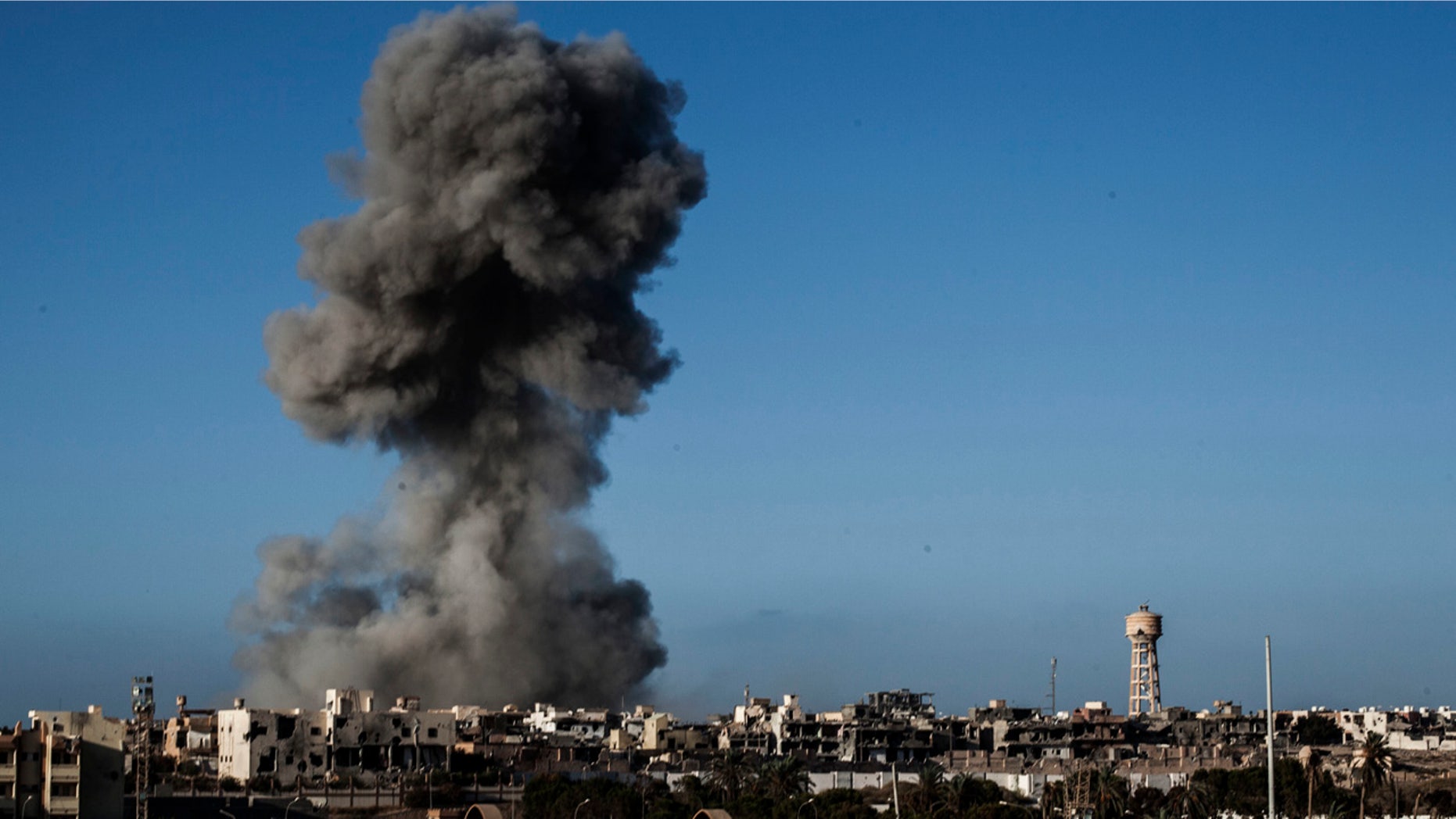 Sept. 28, 2016: Smoke rises after an airstrike on an ISIS-held area of Sirte, Libya.