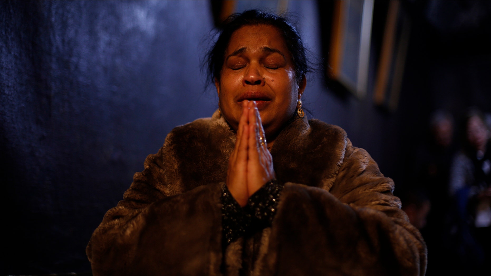 A worshipper prays inside the Church of the Nativity, in Bethlehem, West Bank, Dec. 24, 2017.