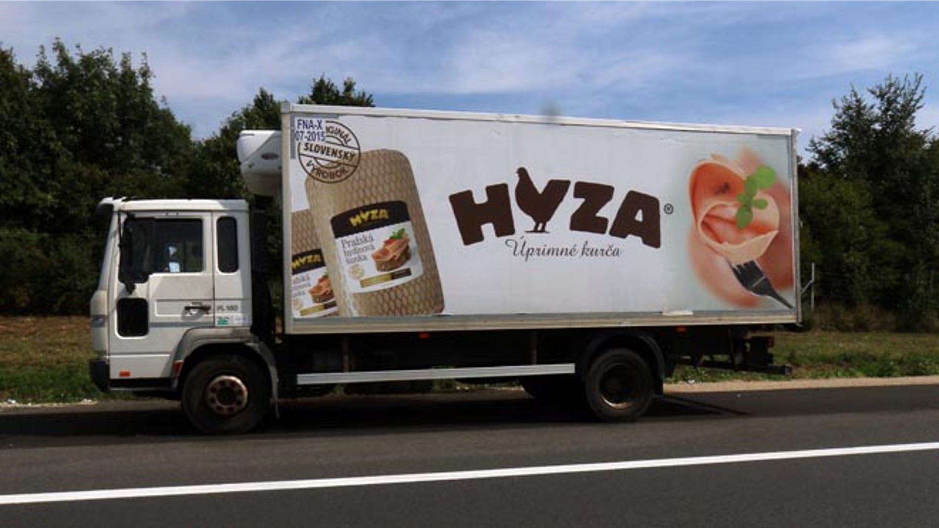Aug. 27: A truck stands on the shoulder of the highway A4 near Parndorf south of Vienna, Austria. At least 20 migrants were found dead in the truck.