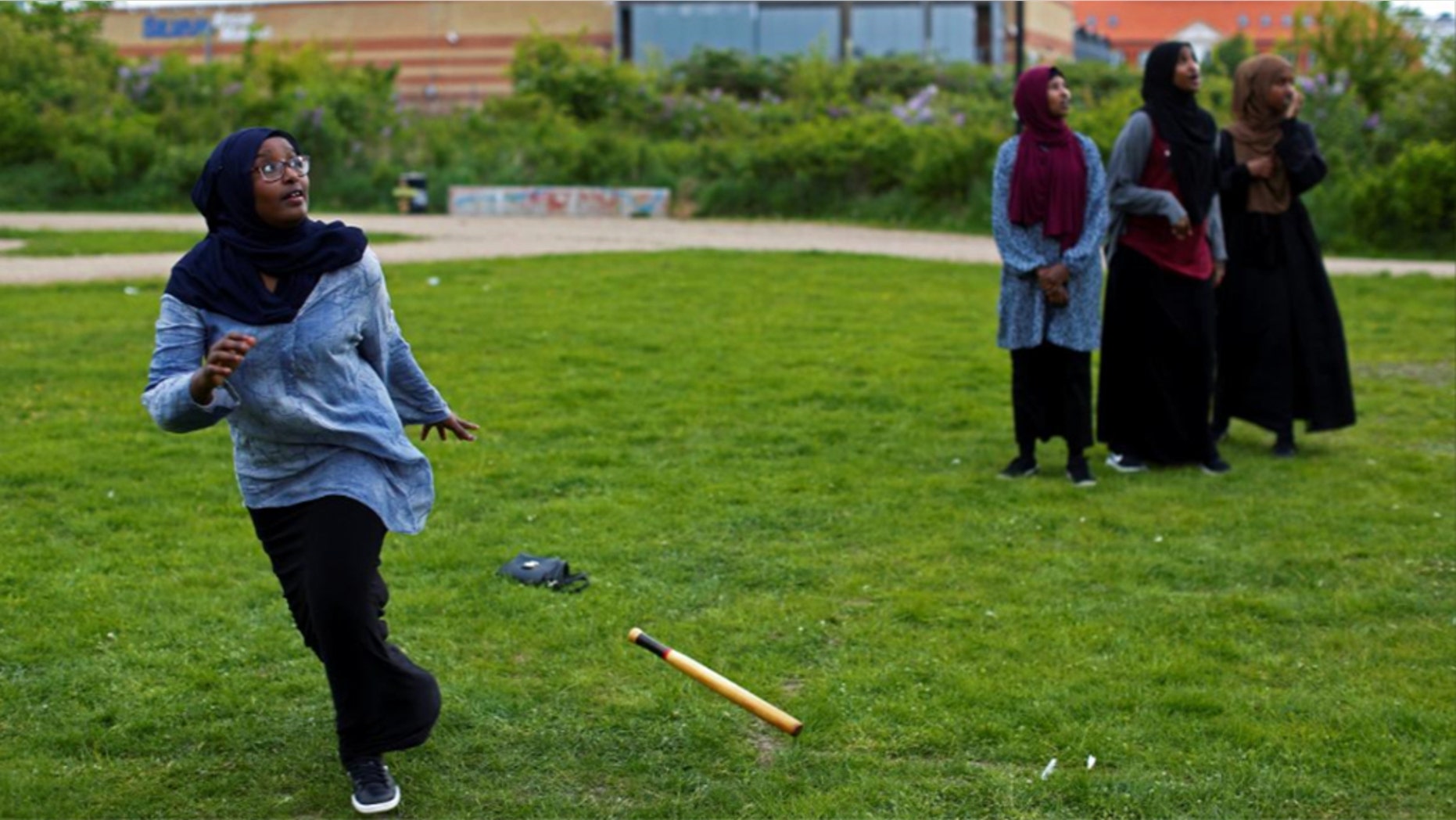 A group of women of Somali descent play rounders in a park in Mjolnerparken, a housing estate featured on the Danish government's "Ghetto List."