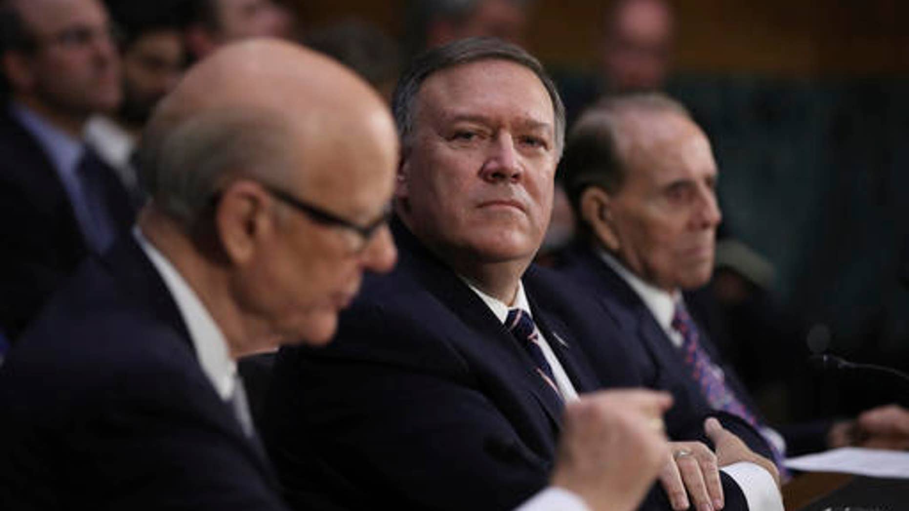 Sen. Pat Roberts, R-Kan. left, introduces CIA Director-designate Rep. Mike Pompeo, R-Kan., center, on Capitol Hill in Washington, Thursday, Jan. 12, 2017, during Pompeo's confirmation hearing before the Senate Intelligence Committee.
