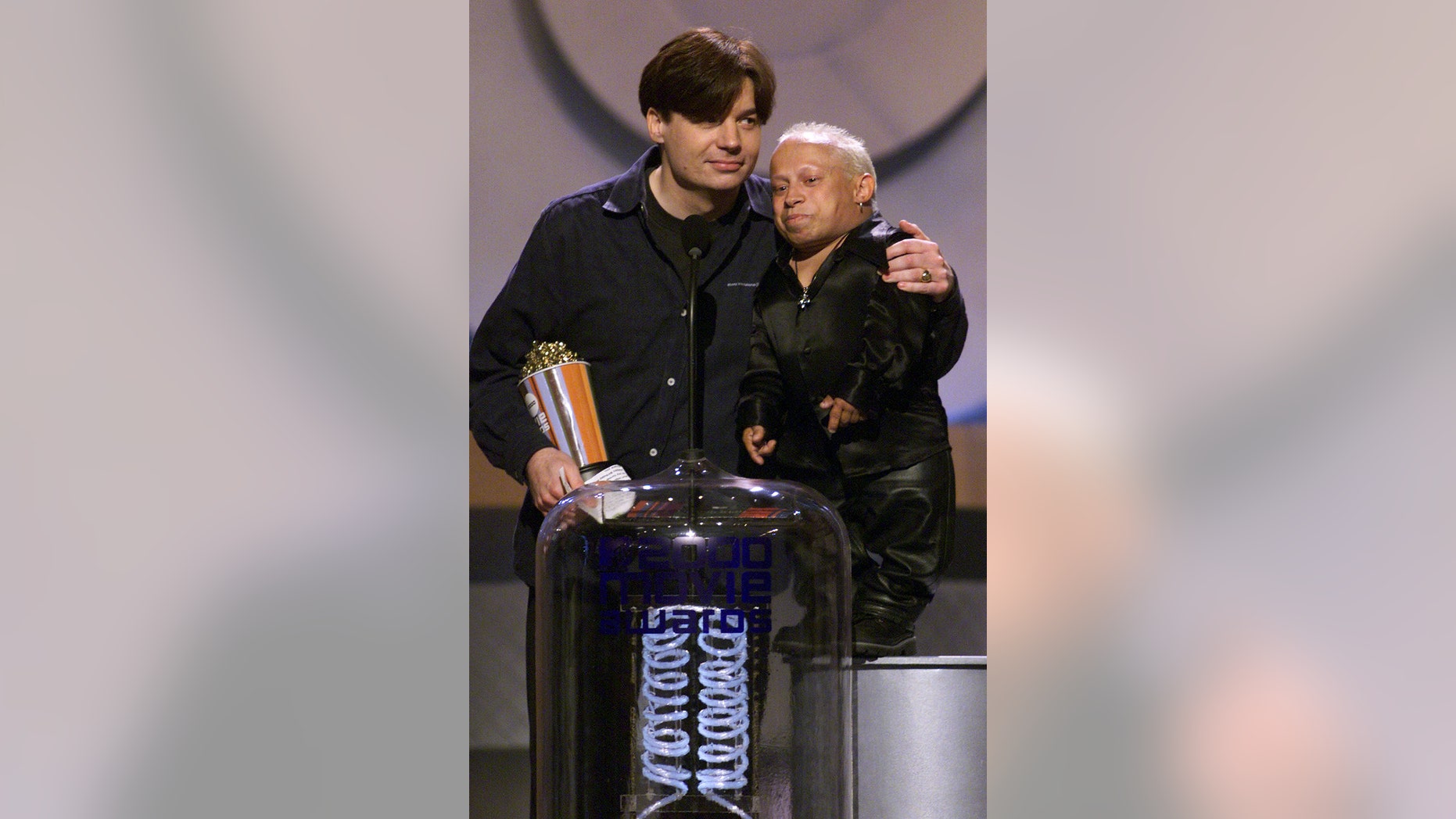 Mike Myers and Verne Troer accept an MTV Movie Award.