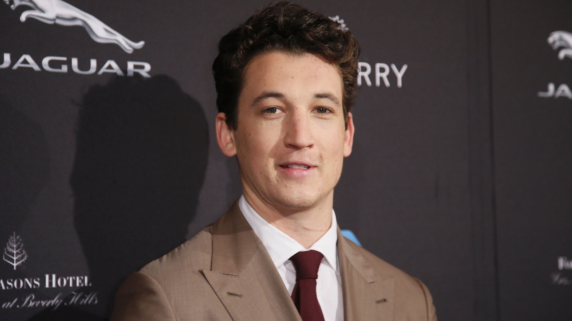 January 10, 2015. Miles Teller poses at the British Academy of Film and Television Arts (BAFTA) Los Angeles 2015 Awards season tea party in Beverly Hills, California.
