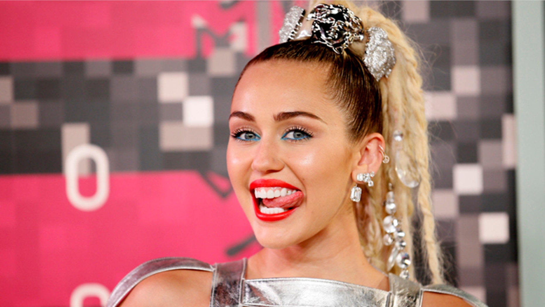 August 30, 2015. Singer and show host Miley Cyrus arrives at the 2015 MTV Video Music Awards in Los Angeles, California.