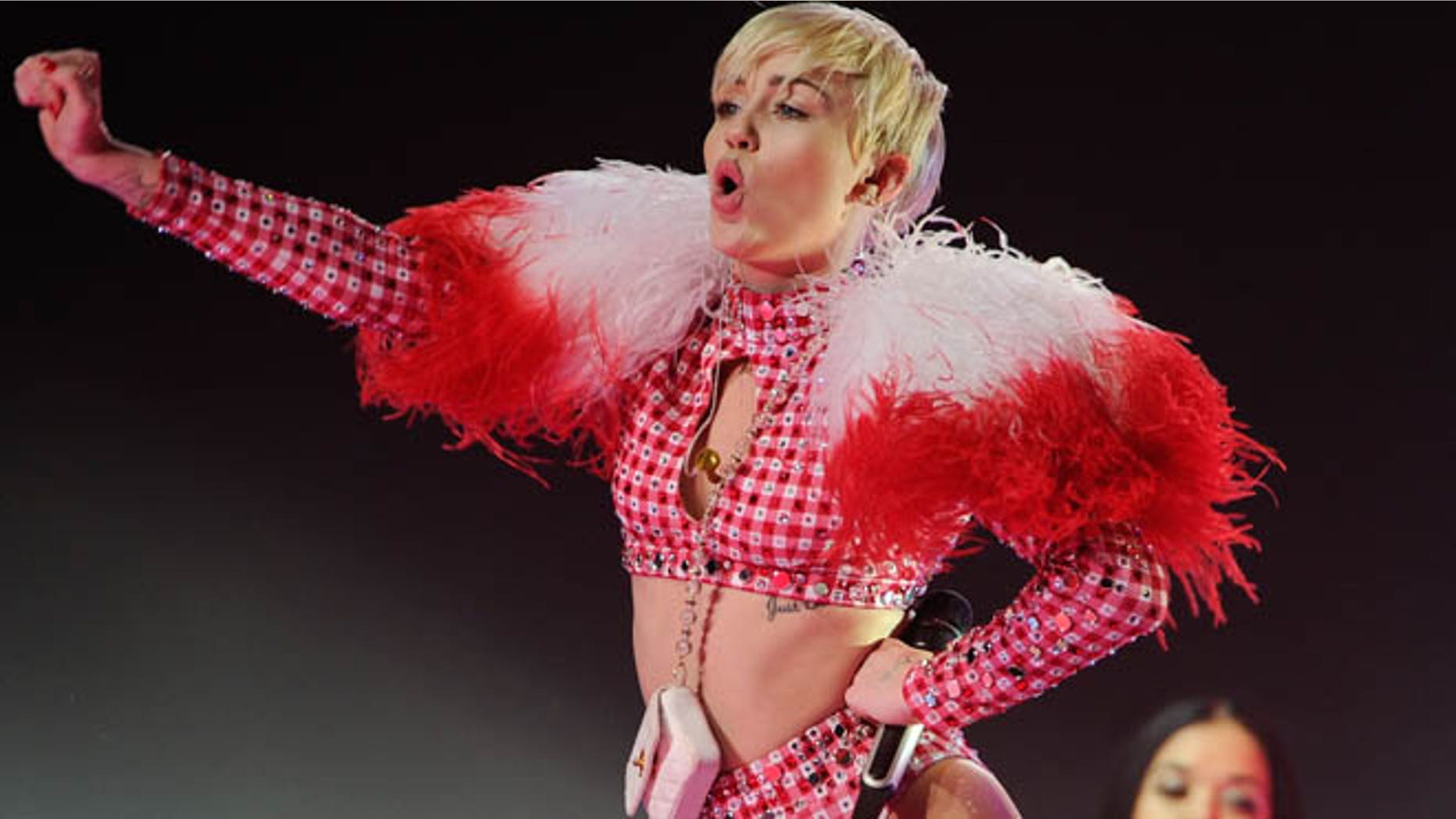 April 5, 2014: This file photo shows singer Miley Cyrus performing at the Barclays Center in New York. Los Angeles police are searching for a pair of burglars they say broke into Miley Cyrus' San Fernando Valley home and got away with jewelry and a luxury car.