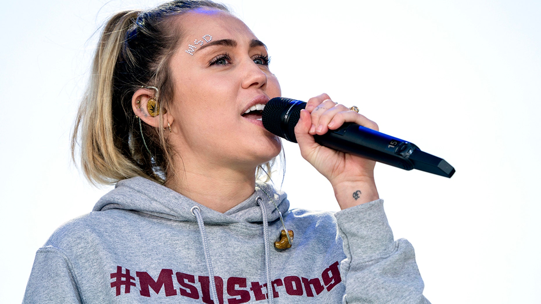 Miley Cyrus performs "The Climb" during the "March for Our Lives" rally in support of gun control in Washington, Saturday, March 24, 2018. (AP Photo/Andrew Harnik)