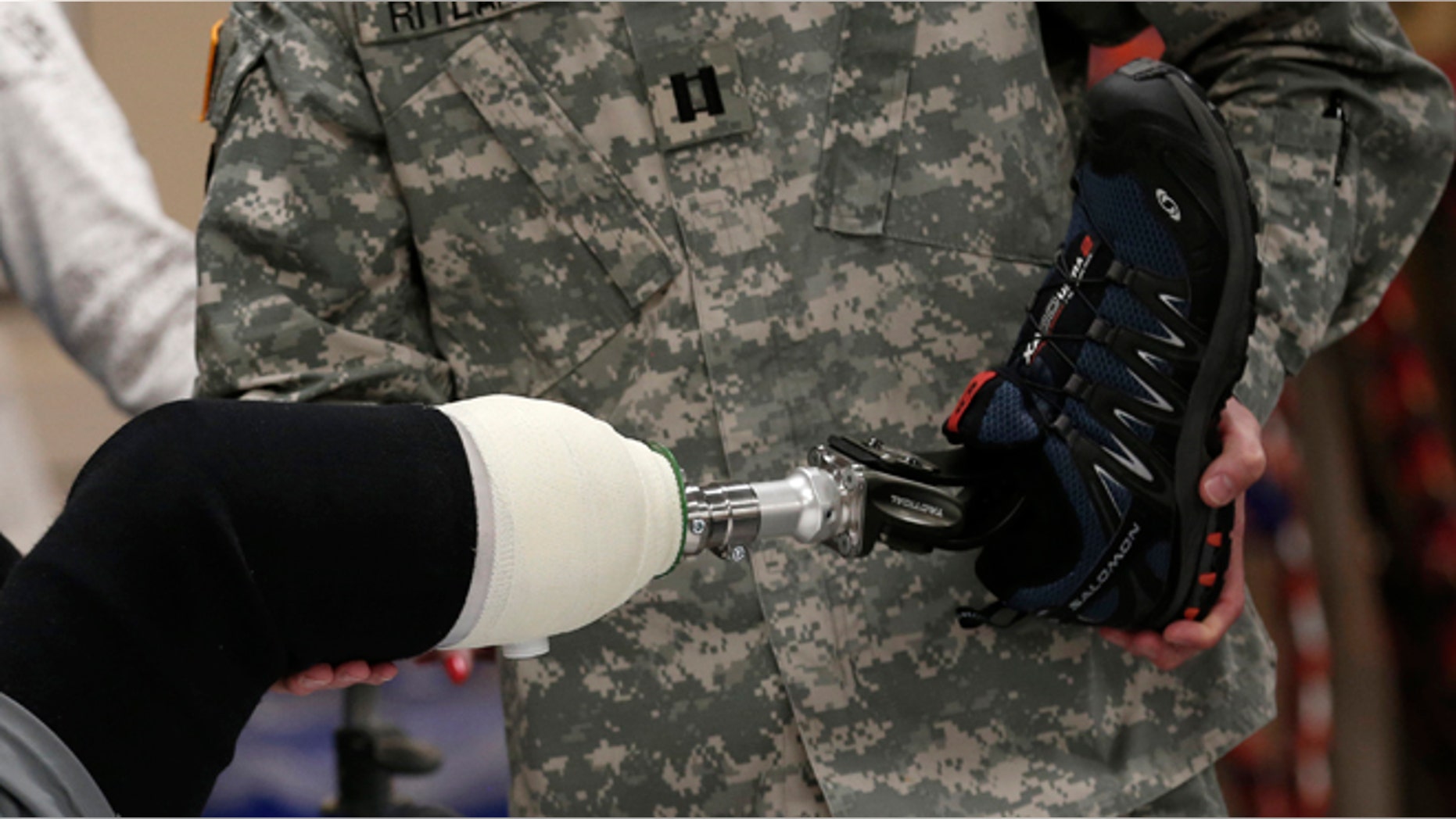 A wounded soldier receives treatment at a rehabilitation center at Walter Reed National Military Medical Center in Bethesda, Maryland, May 10, 2013. A new kind of technology may hold the key to prostheses that feel.