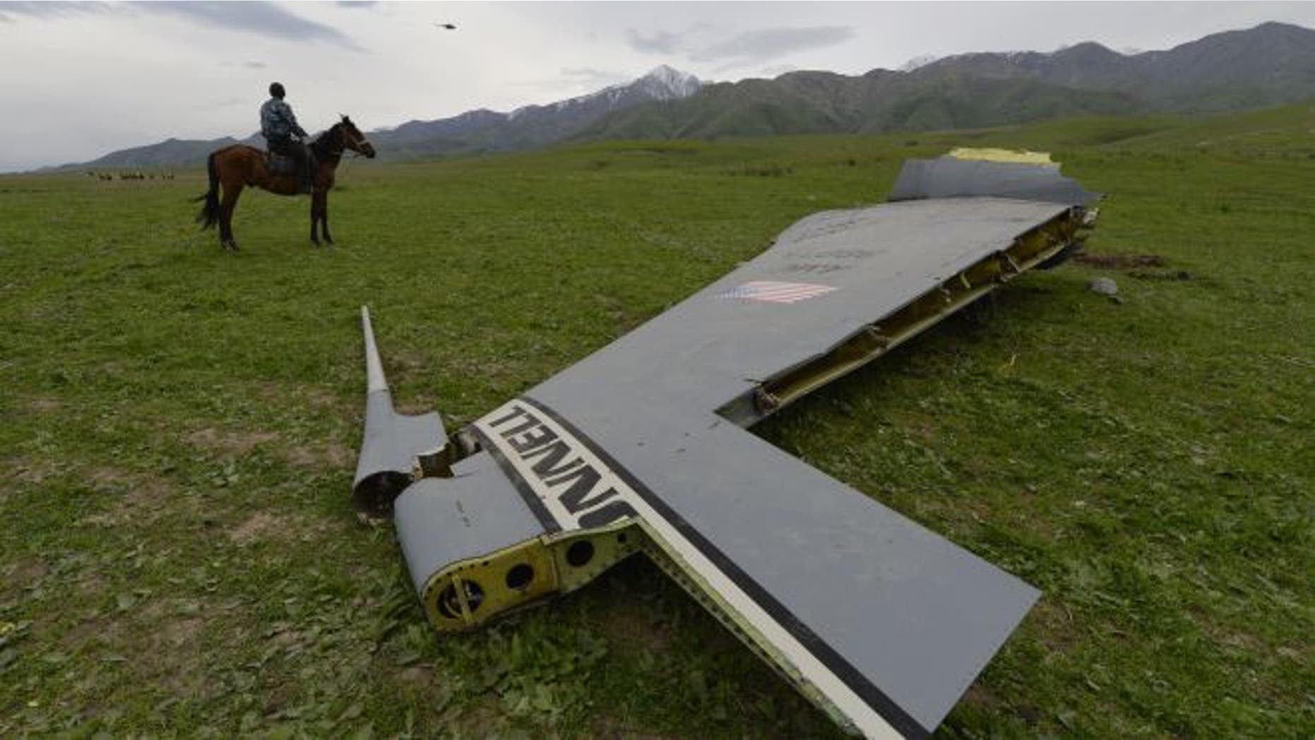 May 3, 2013 - A U.S. Air Force KC-135 tanker aircraft wreckage is strewn across a field near the village of Chaldovar, Kyrgyzstan.