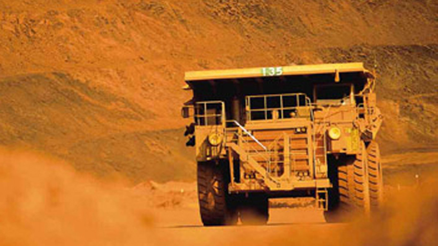 Truckers and train drivers who haul iron ore in Australia's remote Pilbarra region earn an average of $225,000 a year, but the companies that employ them are replacing them with robots. (Handout: BHP Billiton)