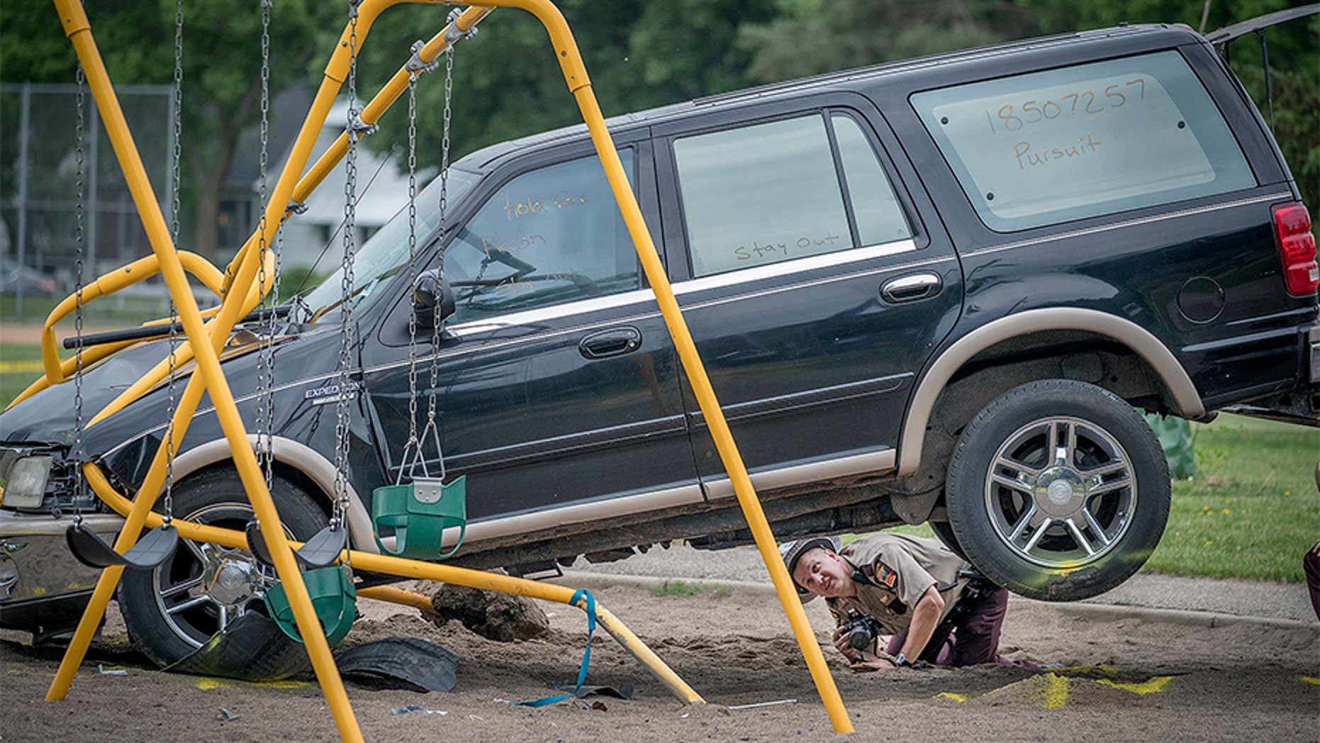 June 11, 2018: Minnesota State Patrol investigates the scene where a driver being pursued by the State Patrol veered into a Minneapolis school playground.