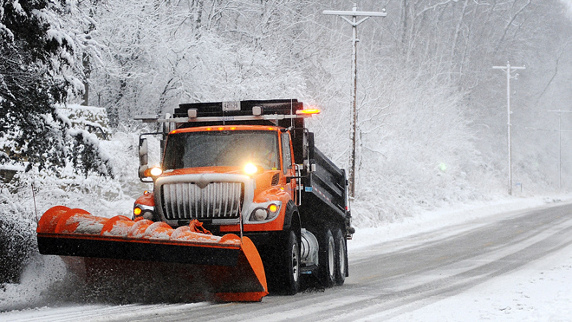 Dec. 9, 2012: A snow plow clears off Old Homer Road, near Winona, Minn. The National Weather Service is predicting a total accumulation of five to 10 inches by Monday morning.