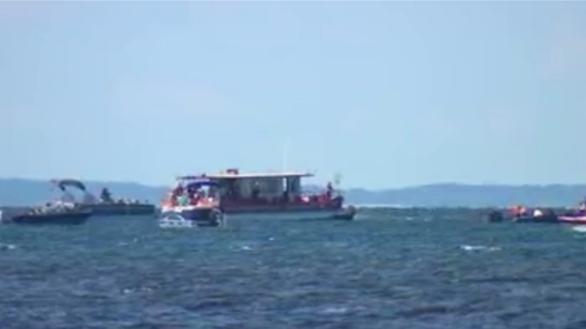 Boats full of protesters circled Minnesota Gov. Mark Dayton's boat as he tried to draw attention to the nationally recognized bass fishing in Lake Mille Lacs.