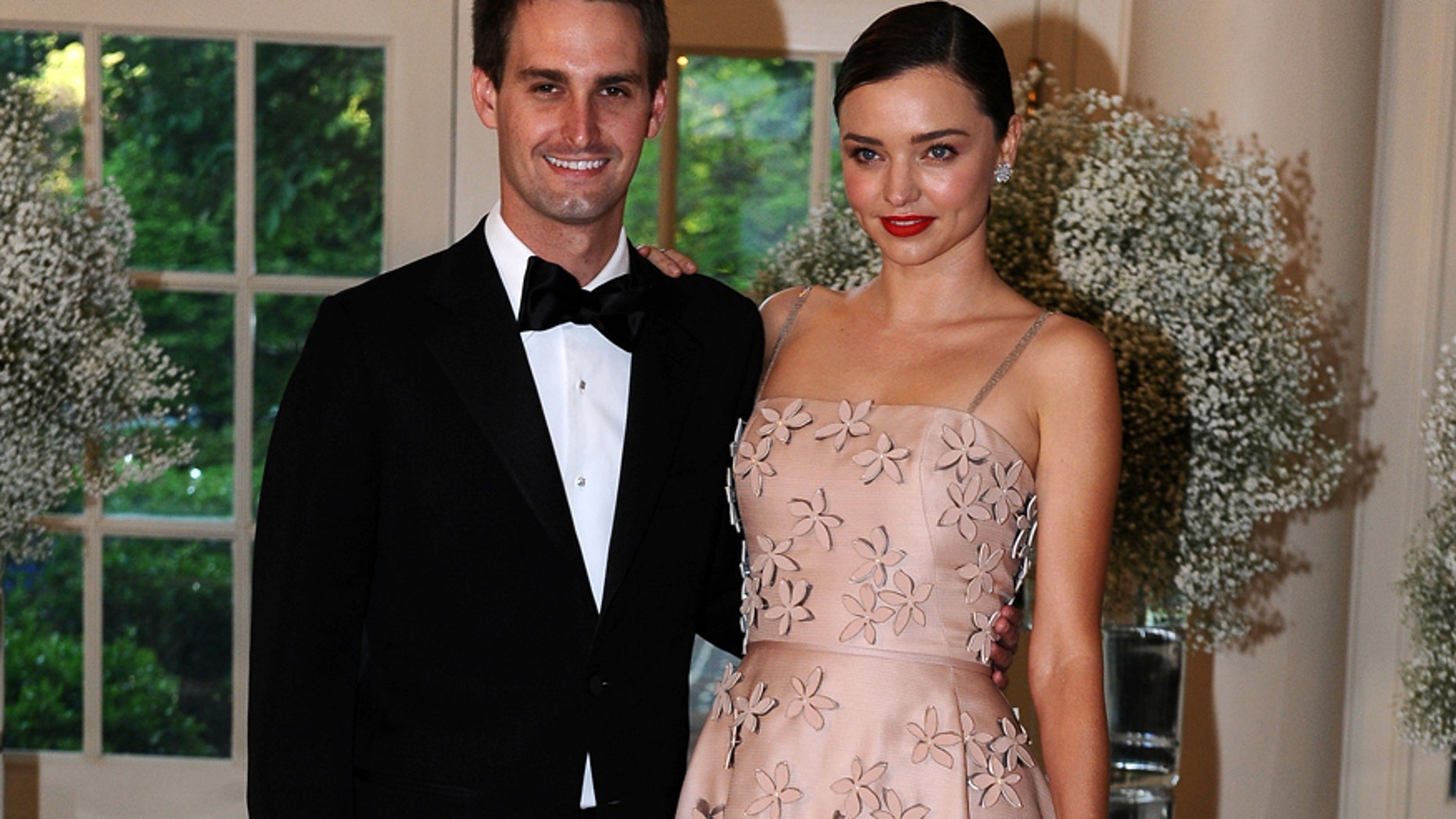 File photo: Evan Spiegel, Chief Executive Officer, Snapchat and model Miranda Kerr arrive for the state dinner in honor of the Nordic Summit at the White House in Washington, May 13, 2016. (Reuters)
